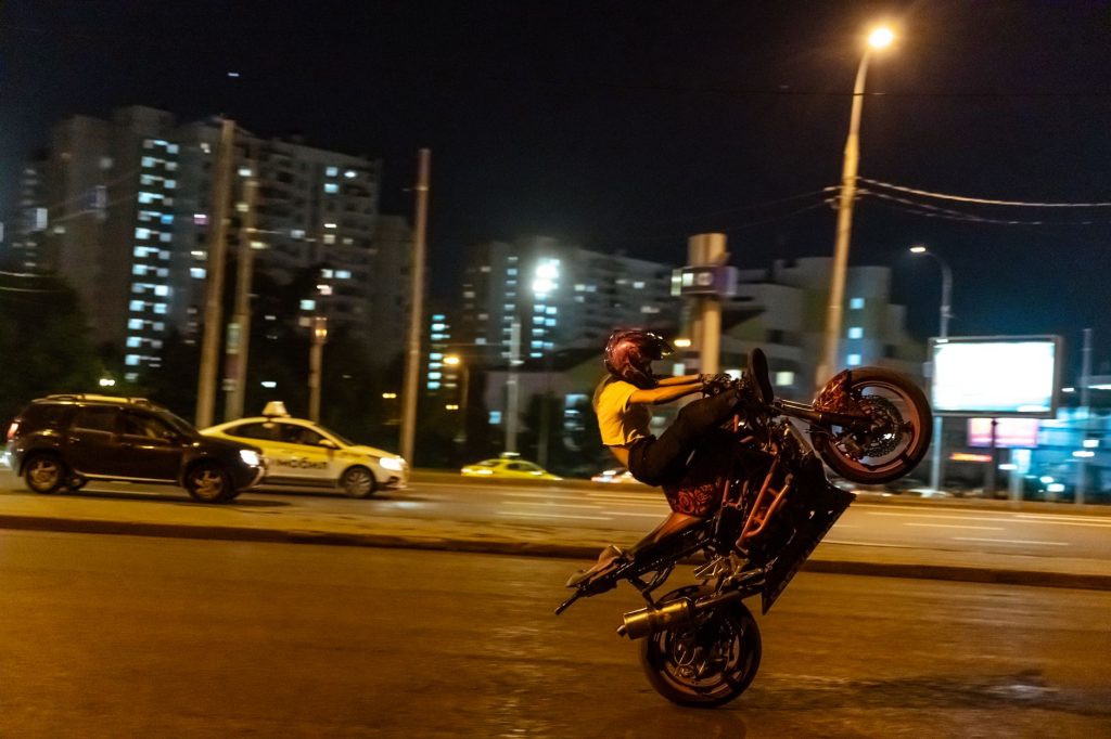 Overbridge Stunt Ends in Crash onto Auto!